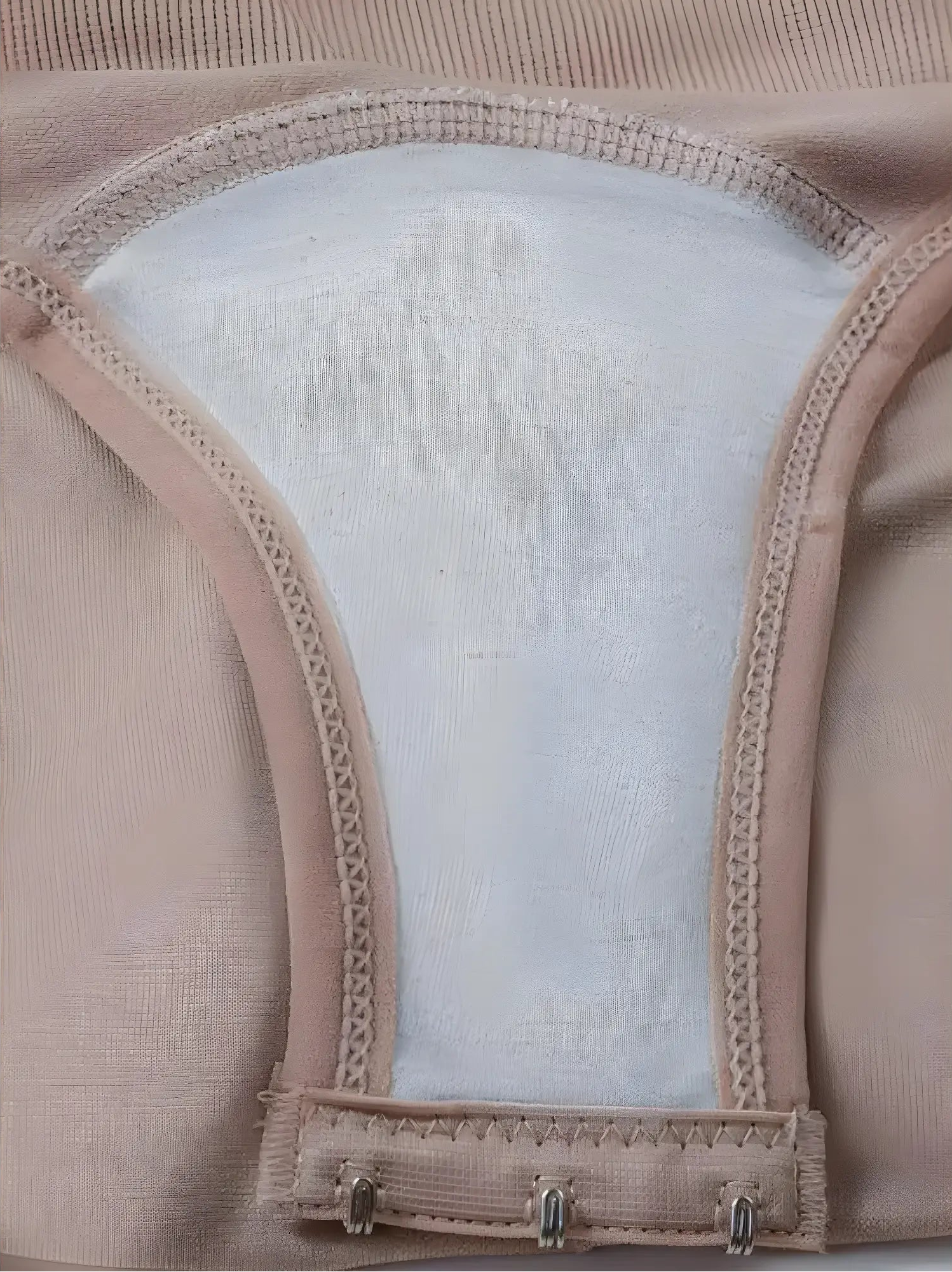 Detailed view of the inner gusset of a Velmora bodysuit, featuring a soft cotton lining for hygiene and a triple-hook adjustable closure for a perfect fit.