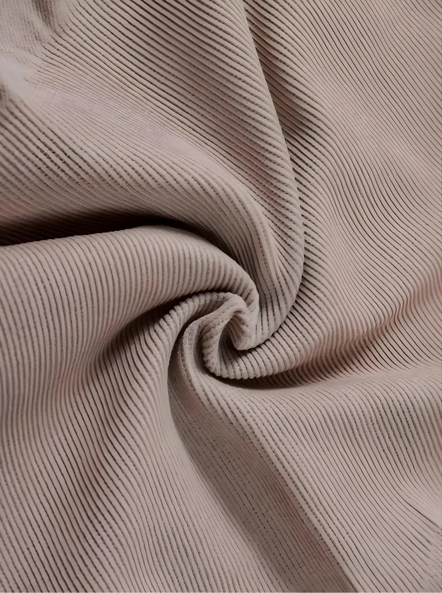 A macro close-up of Velmora’s high-quality, breathable ribbed fabric in a soft mauve tone, showing the intricate weave designed for maximum stretch and firm support.