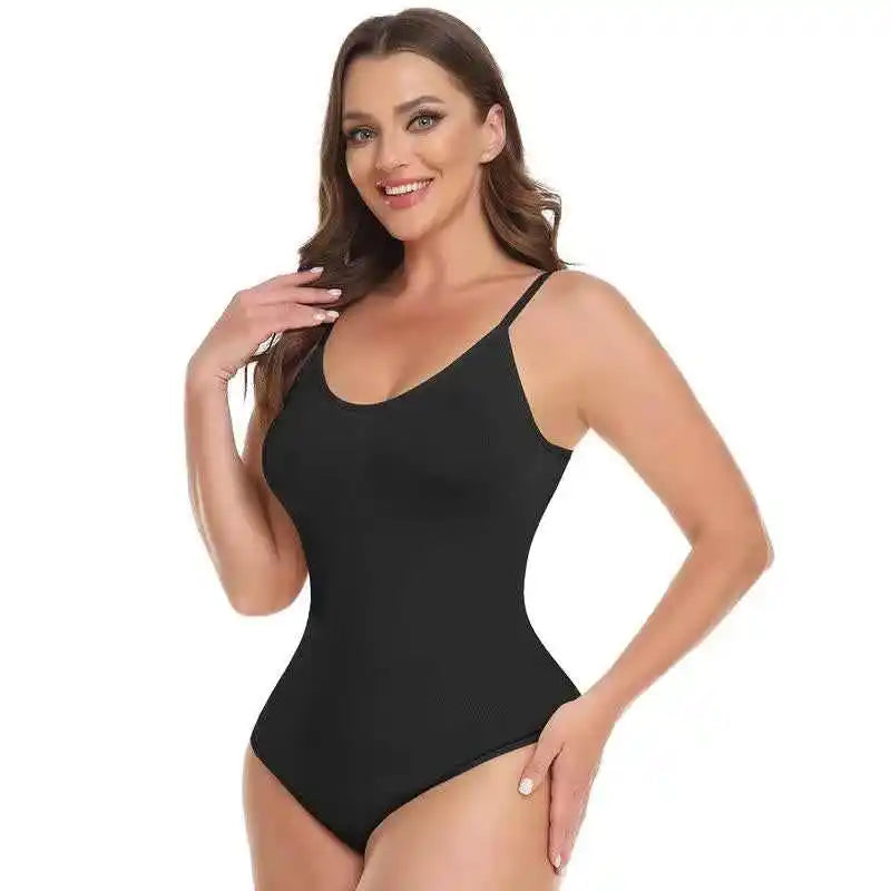 A studio portrait of a woman wearing the Velmora black seamless bodysuit, highlighting the smooth, high-elasticity fabric and the elegant scoop neckline designed for a versatile snatched look.
